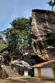 Aluvihara cave temples - The caves temples linked by flights of steps and narrow paths in a jumble of massive rock boulders.