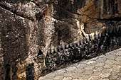 Aluvihara cave temples - Cavities in the rock boulders for oil lamps.