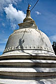 Aluvihara cave temples - The white dagoba at the top of the complex.