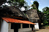 Aluvihara cave temples - The caves temples are linked by flights of steps and narrow paths in a jumble of massive rock boulders.