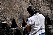 Aluvihara cave temples - Cavities in the rock boulders for oil lamps.