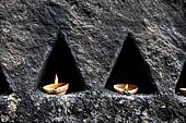 Aluvihara cave temples - Cavities in the rock boulders for oil lamps.