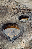 Aluvihara cave temples - Cavities in the rock for oil Lamps cut in to the rock at the base of the dagoba.