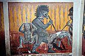 Aluvihara cave temples - Cave 2. Paintings of the cave entrance. Wall paintings of the Buddhist hell.