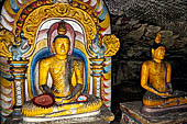 Dambulla cave temples - Cave 4, Paccima Viharaya (Western Temple). Buddha figure sits under an elaborate makara torana arch. 