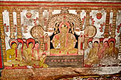 Dambulla cave temples - Cave 3, Maha Alut Viharaya (Great New Temple), paintings of the ceiling show the future Buddha, Maitreya, preaching in a Kandyan-looking pavilion to a group of ascetic disciples.