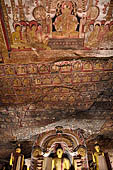 Dambulla cave temples - Cave 3, Maha Alut Viharaya (Great New Temple), paintings of the ceiling show the future Buddha, Maitreya, preaching in a Kandyan-looking pavilion to a group of ascetic disciples.