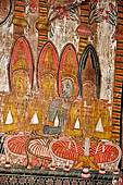 Dambulla cave temples - Cave 3, Maha Alut Viharaya (Great New Temple), paintings of the ceiling show the future Buddha, Maitreya, preaching in a Kandyan-looking pavilion to a group of splendidly adorned gods.