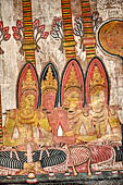 Dambulla cave temples - Cave 3, Maha Alut Viharaya (Great New Temple), paintings of the ceiling show the future Buddha, Maitreya, preaching in a Kandyan-looking pavilion to a group of splendidly adorned gods.