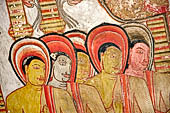 Dambulla cave temples - Cave 3, Maha Alut Viharaya (Great New Temple), paintings of the ceiling show the future Buddha, Maitreya, preaching in a Kandyan-looking pavilion to a group of ascetic disciples.