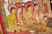 Dambulla cave temples - Cave 3, Maha Alut Viharaya (Great New Temple), paintings of the ceiling show the future Buddha, Maitreya, preaching in a Kandyan-looking pavilion to a group of ascetic disciples.