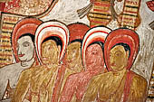 Dambulla cave temples - Cave 3, Maha Alut Viharaya (Great New Temple), paintings of the ceiling show the future Buddha, Maitreya, preaching in a Kandyan-looking pavilion to a group of ascetic disciples.