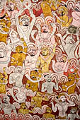 Dambulla  - Cave 2 Maharaja Vihara (Temple of the Great Kings) panels of the Defeat of Mara: Buddha is seated in bhumisparsha mudra (calling earth to witness) whilst demons attack him led by Mara  on elephant.