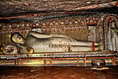 Dambulla cave temples - Cave 2, Maharaja Vihara (Temple of the Great Kings) reclining Buddha statue.