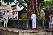 Dambulla cave. People offering to the bho tree.