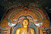 Dambulla cave temples - Cave 3, Maha Alut Viharaya (Great New Temple), The meditating  Buddha statue sits under a makara-torana where the typical makaras are replaced with white lions.