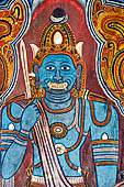 Mulkirigala cave temples - The first cave of the first terrace. Painting of the demonic blue Vibhishana.