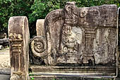 Polonnaruwa - the Vatadage. Detail of the balustrade of the western stairway decorated with lions and makaras. 