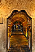 Kandy - The Sacred Tooth Relic Temple, carved stone entrance to the shrine,  adorned with a moonstone, guardstones and topped by a makara torana archway.