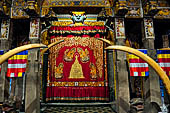 Kandy - The Sacred Tooth Relic Temple, The shrine doorway hidden behind a red curtain. 