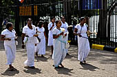 Kandy - Pilgrims to the Temple of the Sacred Tooth. 