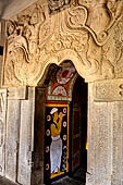 Kandy - The Sacred Tooth Relic Temple, carved stone entrance to the shrine,  adorned with a moonstone, guardstones and topped by a makara torana archway. 