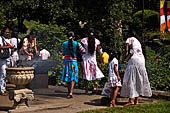 Kandy - Pilgrims to the Temple of the Sacred Tooth. 