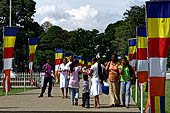 Kandy - Pilgrims to the Temple of the Sacred Tooth. 