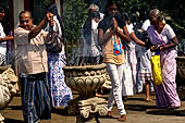 Kandy - Pilgrims to the Temple of the Sacred Tooth. 