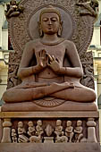 Kandy - Temple of the Sacred Tooth Relic. Buddha statue at the entrance of the Museum of Buddhism.