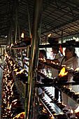 Kandy - The Sacred Tooth Relic Temple, votive lamps.#