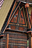 Bori Parinding villages - Traditional tongkonan house. The exterior walls are covered with wood panels etched with geometric patterns and painted with black and red colours. 