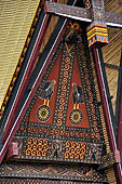 Bori Parinding villages - Traditional tongkonan house. The exterior walls are covered with wood panels etched with geometric patterns and painted with black and red colours. 