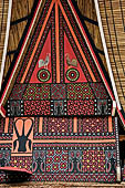 Bori Parinding villages - Traditional tongkonan house. The exterior walls are covered with wood panels etched with geometric patterns and painted with black and red colours. 