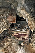 Londa - Inside the cave there is a collection of coffins, many of them rotted away, with the bones scattered or heaped in piles