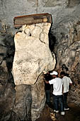 Londa - Inside the cave there is a collection of coffins, many of them rotted away, with the bones scattered or heaped in piles