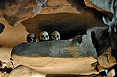 Londa - Inside the cave there is a collection of coffins, many of them rotted away, with the bones scattered or heaped in piles