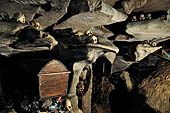 Londa - Inside the cave there is a collection of coffins, many of them rotted away, with the bones scattered or heaped in piles