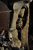 Londa - Inside the cave there is a collection of coffins, many of them rotted away, with the bones scattered or heaped in piles