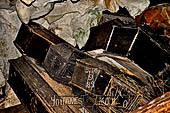 Londa - Inside the cave there is a collection of coffins, many of them rotted away, with the bones scattered or heaped in piles