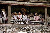 Londa - The entrance to the cave is guarded by a balcony of tau tau. 