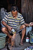 The market of Makale - stalls selling local produce including coffee, tobacco, buckets of live eels, piles of fresh and dried fish, and jugs of  'balok'