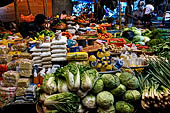 The market of Makale - stalls selling local produce including coffee, tobacco, buckets of live eels, piles of fresh and dried fish, and jugs of  'balok'