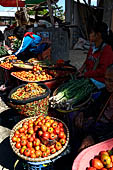 The market of Makale - stalls selling local produce including coffee, tobacco, buckets of live eels, piles of fresh and dried fish, and jugs of  'balok'