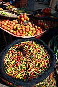 The market of Makale - stalls selling local produce including coffee, tobacco, buckets of live eels, piles of fresh and dried fish, and jugs of  'balok'