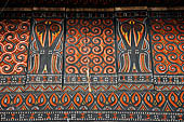 Pallawa - Traditional tongkonan house. The exterior walls are covered with wood panels etched with geometric patterns and painted with black and red colours. 